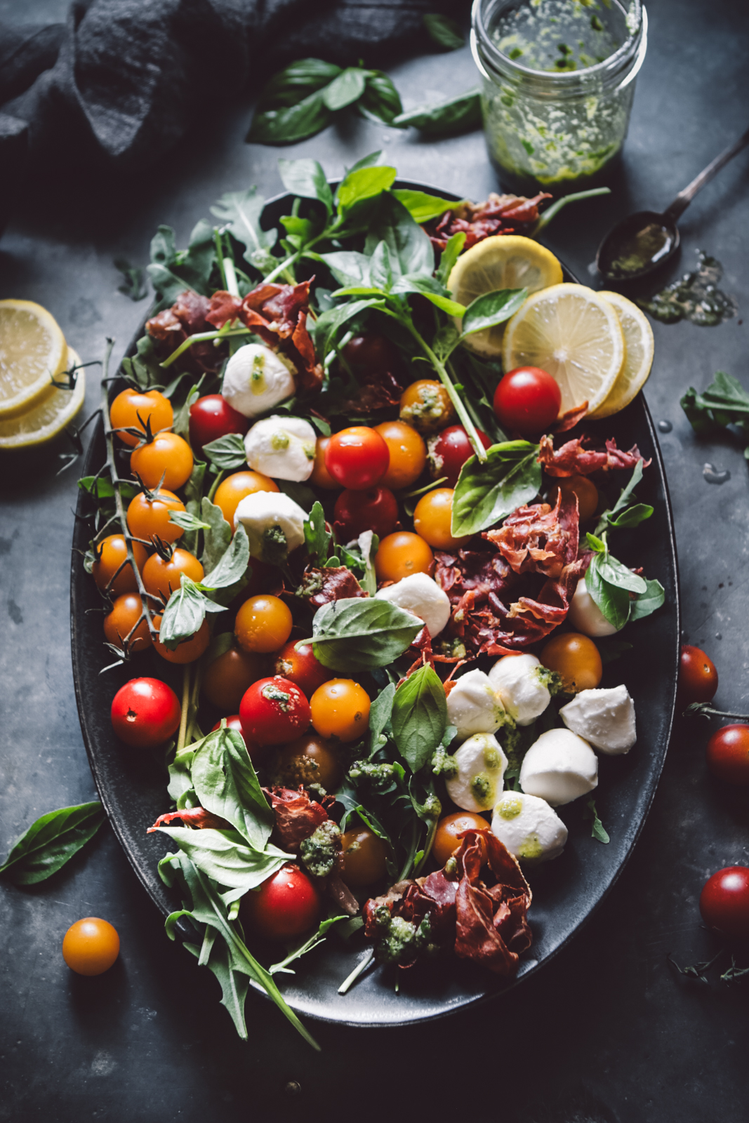 arugula tomato salad with lemony pesto dressing